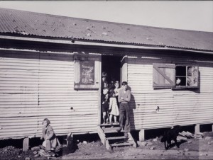 Kids waiting for Sunday School to open at Camp Pell late 1940s. They carried the moral stain of growing up there for years. 